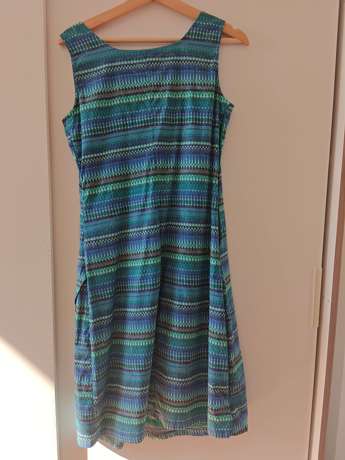 Sleeveless summer dress in green and blue tones