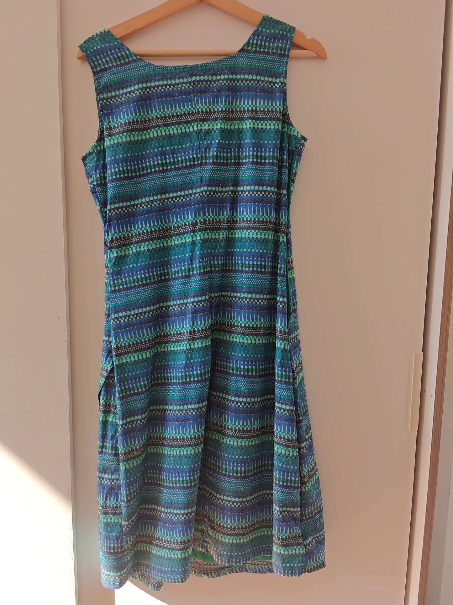 Sleeveless summer dress in green and blue tones